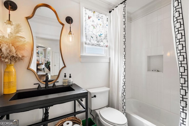 full bathroom with toilet, ornamental molding, shower / tub combo, and a sink