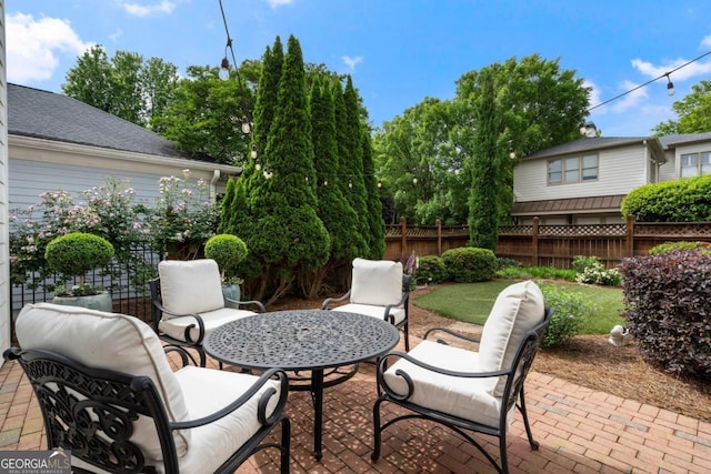 view of patio / terrace featuring fence