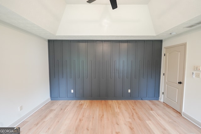5582 Rockingwood Ct, Atlanta, GA 30349 - spare room featuring wood finished floors, ceiling fan, and a tray ceiling