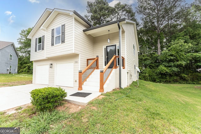 view of front of home featuring driveway, a front lawn, and a garage