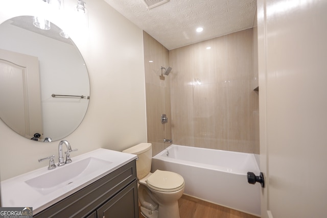 bathroom with recessed lighting, toilet, vanity, wood finished floors, and bathing tub / shower combination