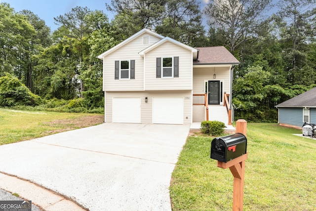 split level home featuring an attached garage, driveway, and a front lawn