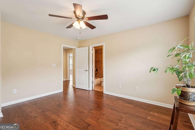 empty room with wood finished floors, baseboards, and ceiling fan