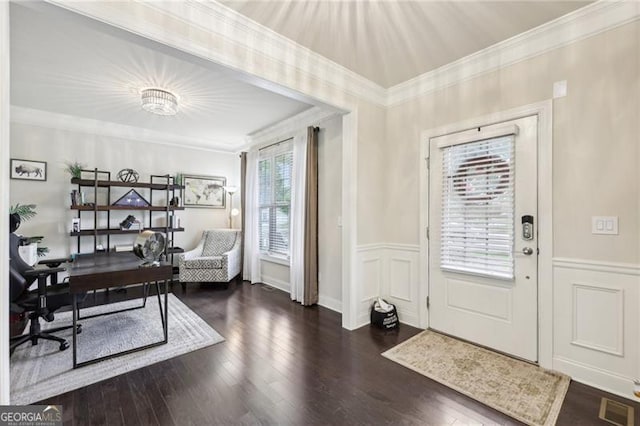 entryway with a decorative wall, wood finished floors, wainscoting, and ornamental molding