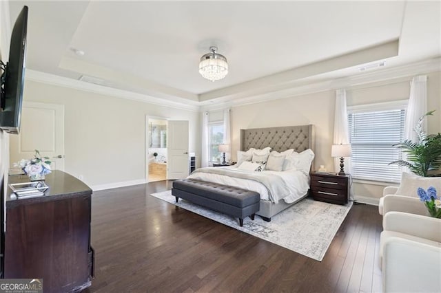 bedroom featuring multiple windows, baseboards, a raised ceiling, and dark wood-style floors