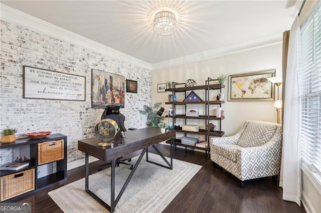 office with wood finished floors, baseboards, an accent wall, a chandelier, and ornamental molding