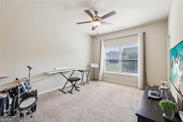 miscellaneous room with visible vents, baseboards, a ceiling fan, and carpet floors