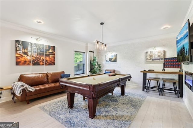 playroom with baseboards, ornamental molding, light wood finished floors, and billiards