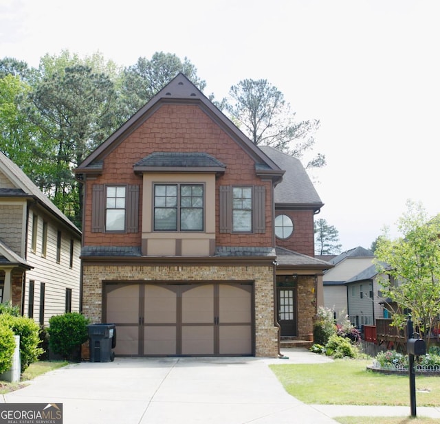 craftsman house featuring a front lawn, driveway, and an attached garage