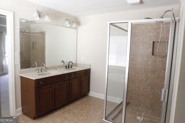 full bath featuring a sink, double vanity, a stall shower, and visible vents
