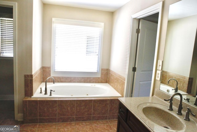bathroom featuring vanity, a whirlpool tub, and tile patterned floors