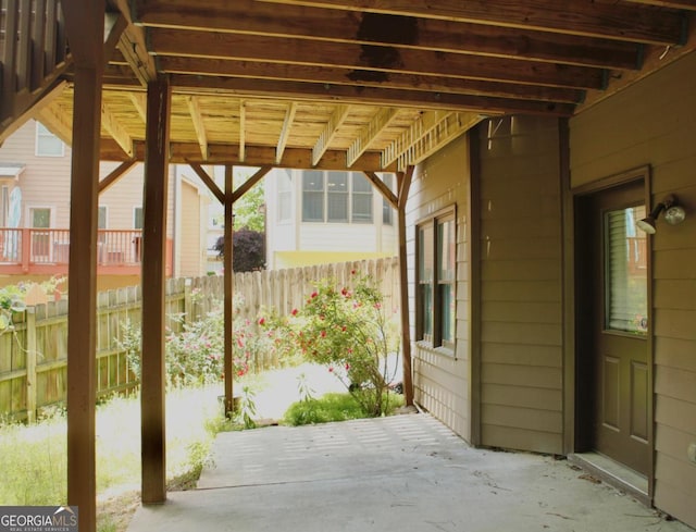 view of patio featuring fence