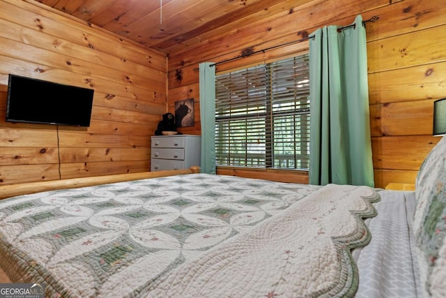 bedroom featuring wooden walls and wood ceiling