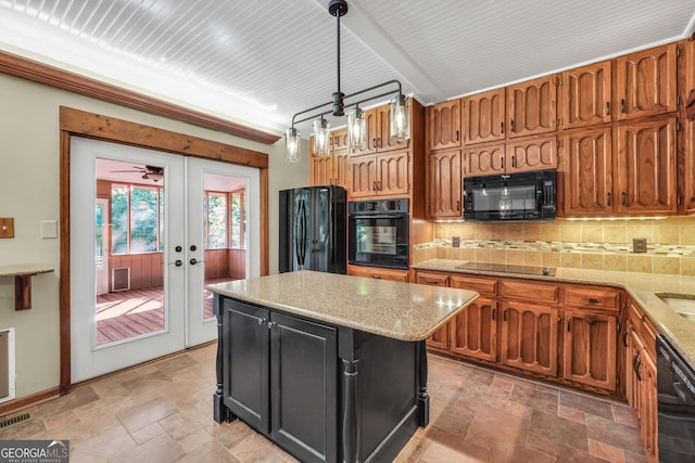 341 Fox Rd, Griffin, GA 30224 - kitchen with black appliances, stone tile flooring, and decorative backsplash