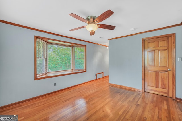 341 Fox Rd, Griffin, GA 30224 - unfurnished room with light wood-type flooring, ornamental molding, baseboards, ceiling fan, and a smoke detector