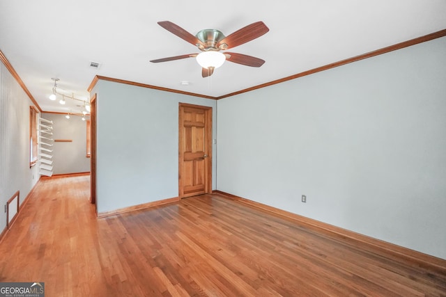 341 Fox Rd, Griffin, GA 30224 - unfurnished room featuring ornamental molding, light wood-style floors, a ceiling fan, and baseboards