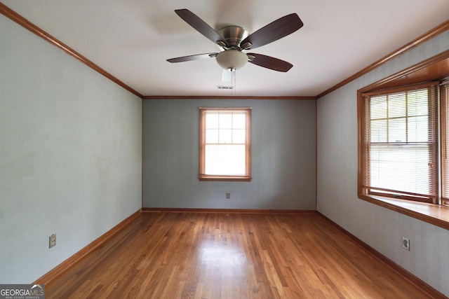341 Fox Rd, Griffin, GA 30224 - empty room with light wood-style flooring, crown molding, baseboards, and ceiling fan