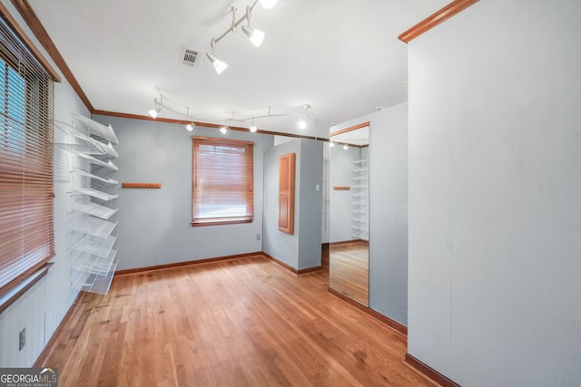 341 Fox Rd, Griffin, GA 30224 - empty room featuring wood finished floors, baseboards, and crown molding