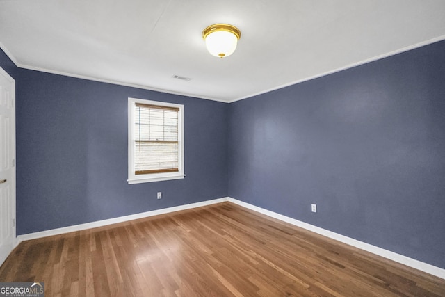 341 Fox Rd, Griffin, GA 30224 - spare room featuring ornamental molding, wood finished floors, and baseboards