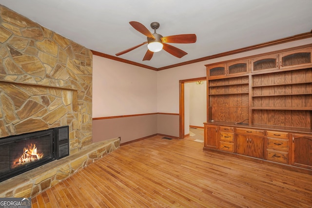 341 Fox Rd, Griffin, GA 30224 - unfurnished living room with a fireplace, a ceiling fan, light wood-style floors, ornamental molding, and baseboards