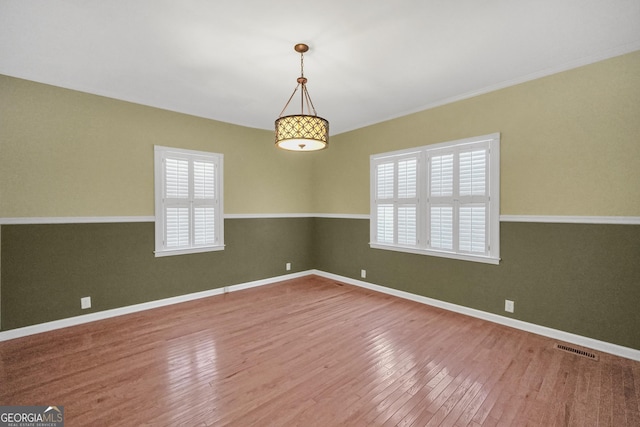 341 Fox Rd, Griffin, GA 30224 - unfurnished room featuring healthy amount of natural light, wood finished floors, and baseboards