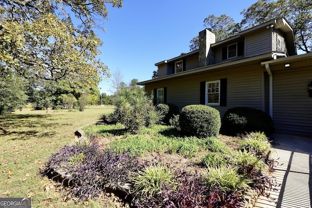 341 Fox Rd, Griffin, GA 30224 - view of side of home with a chimney and a lawn