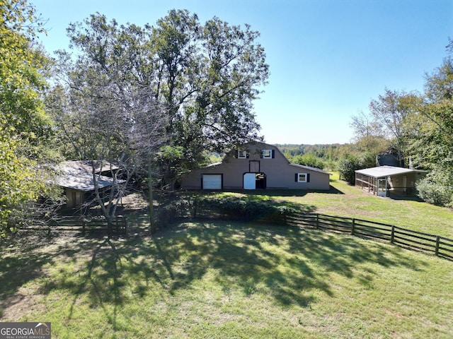341 Fox Rd, Griffin, GA 30224 - view of yard featuring a detached garage, a barn, and an outbuilding