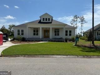 2191 Isles Of St Marys Way, Saint Marys, GA 31558 - view of front of property with a porch, a shingled roof, and board and batten siding