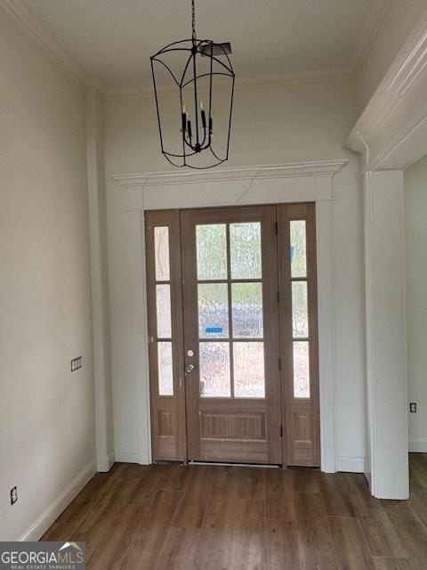 2191 Isles Of St Marys Way, Saint Marys, GA 31558 - entryway featuring an inviting chandelier, wood finished floors, and ornamental molding