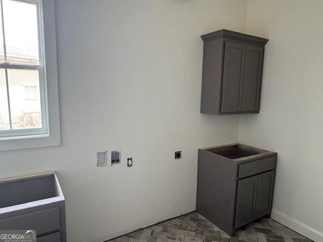 2191 Isles Of St Marys Way, Saint Marys, GA 31558 - clothes washing area featuring hookup for an electric dryer, a healthy amount of sunlight, and cabinet space
