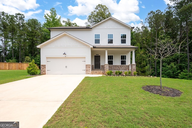 63 Brookstone Park E, Acworth, GA 30101 - view of front of home featuring driveway, covered porch, a garage, and stone siding