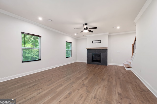 63 Brookstone Park E, Acworth, GA 30101 - unfurnished living room featuring a ceiling fan, wood finished floors, recessed lighting, a fireplace, and ornamental molding