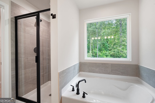 63 Brookstone Park E, Acworth, GA 30101 - bathroom featuring a bath and a stall shower