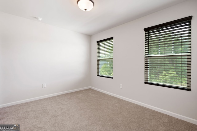 63 Brookstone Park E, Acworth, GA 30101 - empty room with carpet floors, baseboards, and a smoke detector
