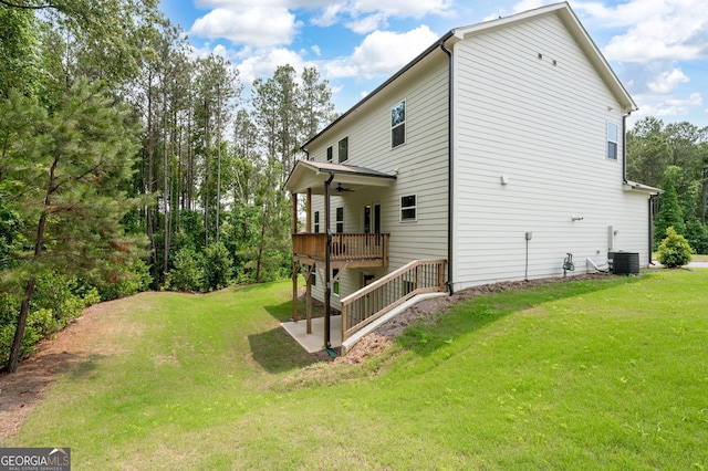 63 Brookstone Park E, Acworth, GA 30101 - view of side of property featuring a ceiling fan, a yard, a wooden deck, and central air condition unit