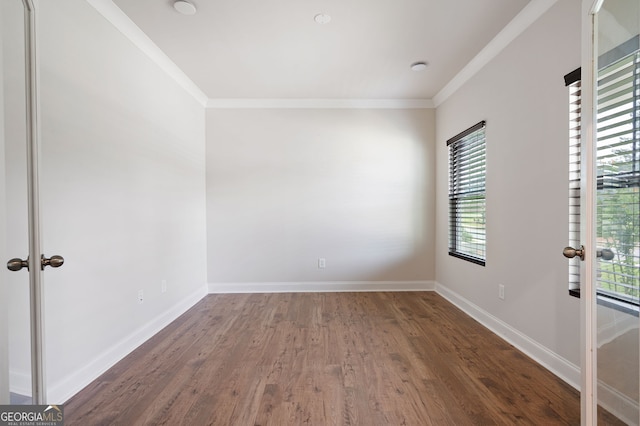 63 Brookstone Park E, Acworth, GA 30101 - empty room with plenty of natural light, crown molding, wood finished floors, french doors, and baseboards