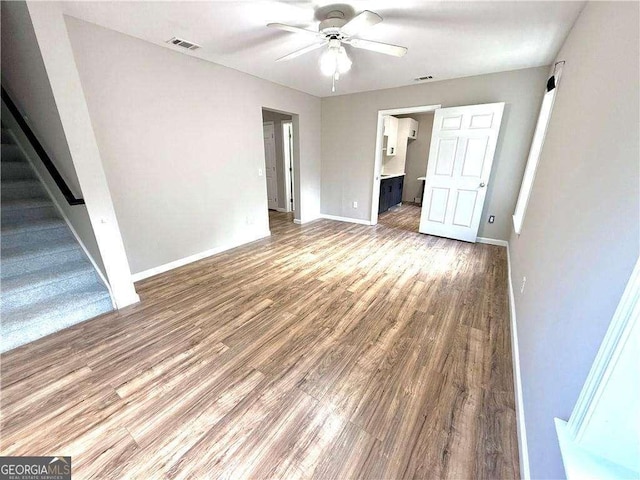 6945 Autumn Hills Dr, Cumming, GA 30028 - interior space featuring a ceiling fan, baseboards, light wood-style flooring, and visible vents