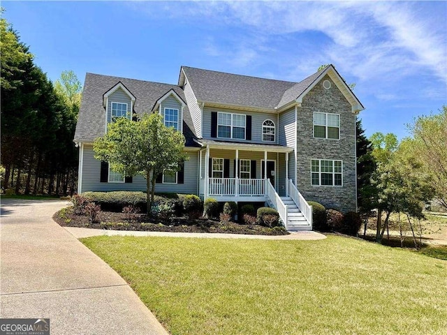 6945 Autumn Hills Dr, Cumming, GA 30028 - view of front of house featuring stone siding, a porch, a front lawn, and stairway