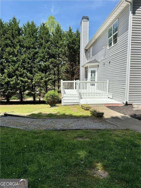 6945 Autumn Hills Dr, Cumming, GA 30028 - view of yard with a deck