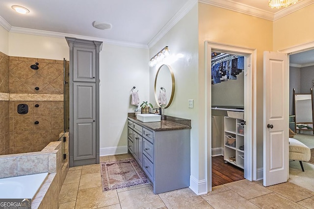 1122 Irongate, Macon, GA 31220 - bathroom featuring crown molding, vanity, baseboards, and tiled shower
