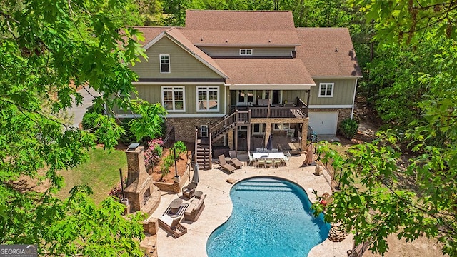 1122 Irongate, Macon, GA 31220 - back of property with a patio, fence, a deck, stairway, and brick siding