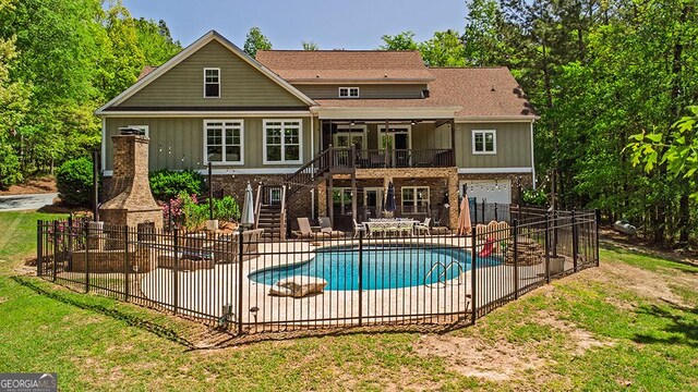 1122 Irongate, Macon, GA 31220 - rear view of house with stairway, fence, a patio, and brick siding