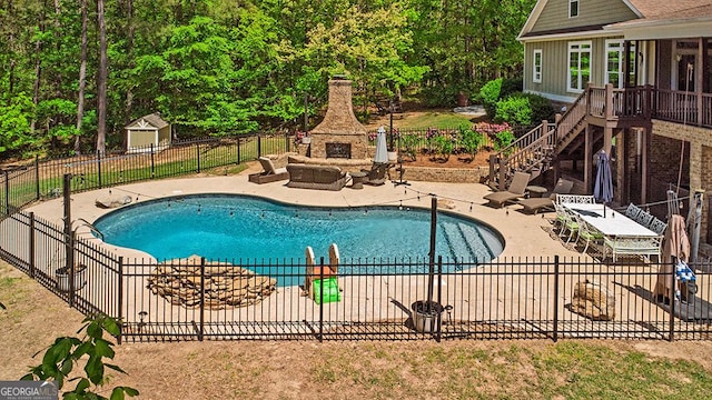 1122 Irongate, Macon, GA 31220 - view of swimming pool with fence, a patio area, an outdoor stone fireplace, stairway, and a fenced in pool