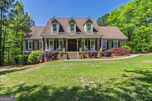 1122 Irongate, Macon, GA 31220 - cape cod home featuring a porch, a front lawn, and board and batten siding