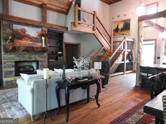 366 Shepherds Way, Morganton, GA 30560 - living room featuring a high ceiling, hardwood / wood-style floors, stairs, and a stone fireplace
