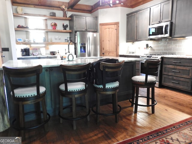 366 Shepherds Way, Morganton, GA 30560 - kitchen with appliances with stainless steel finishes, light countertops, open shelves, tasteful backsplash, and light wood finished floors