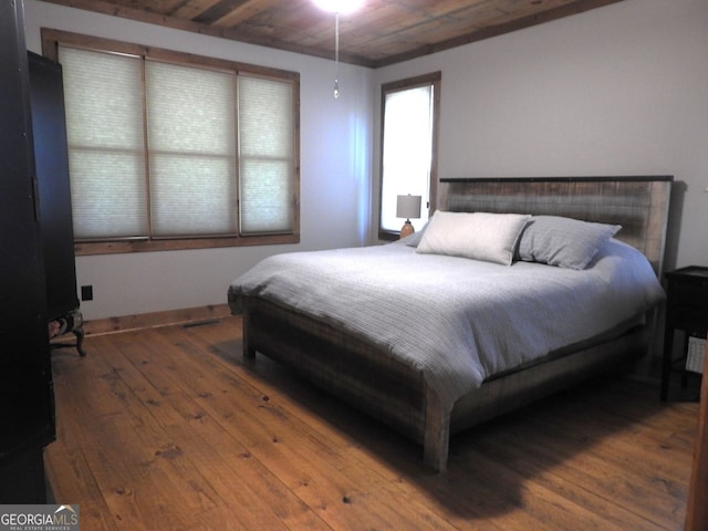 bedroom featuring wood ceiling and hardwood / wood-style floors