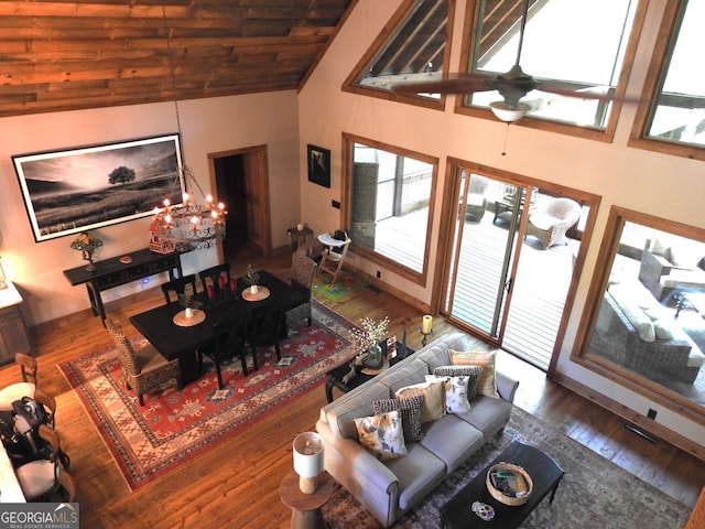 living room featuring ceiling fan, high vaulted ceiling, and wood finished floors