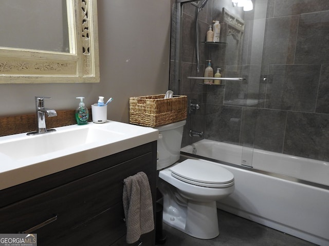 bathroom featuring vanity, toilet, and shower / bath combination with glass door