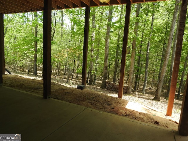 exterior space with a forest view